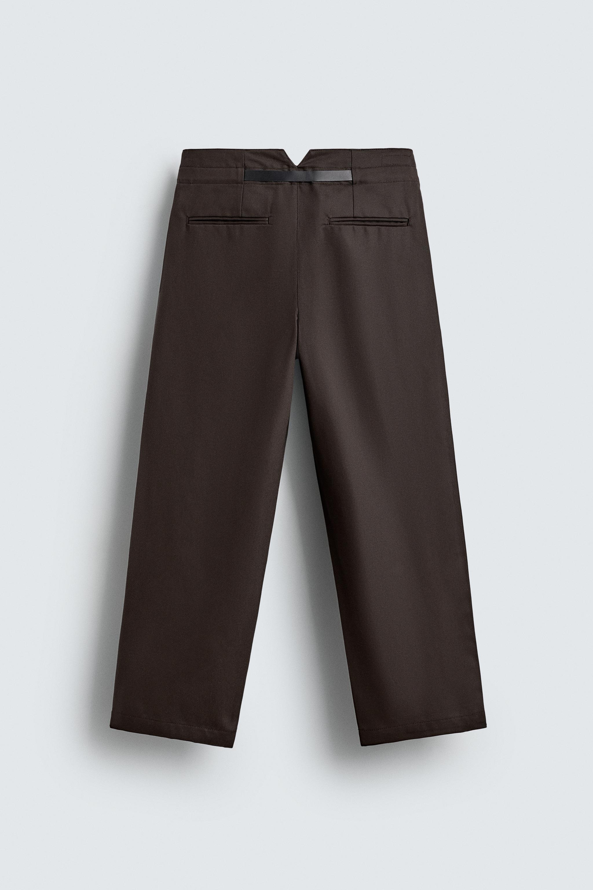 PANTALON À PLIS ET CEINTURE